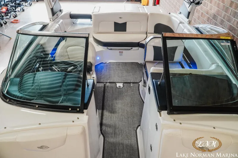 Slide: The Image of 2018 Chaparral 227 SSX boat interior with seating and steering wheel, Lake Norman Marina. - 13