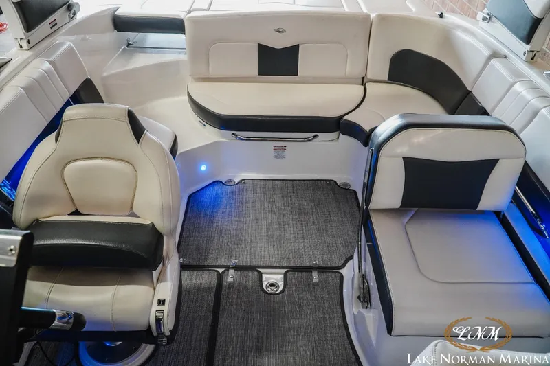 Slide: The Image of Interior of 2018 Chaparral 227 SSX boat with stylish seating and blue accent lighting. - 14