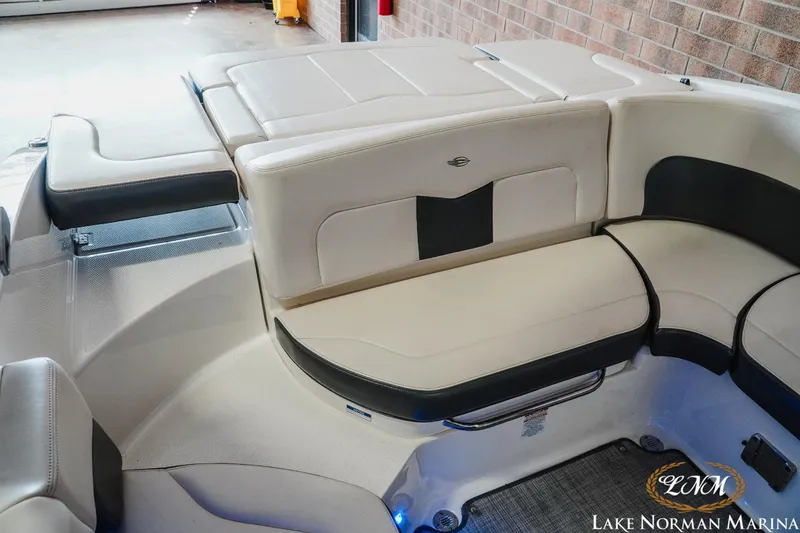 Slide: The Image of 2018 Chaparral 227 SSX boat interior with beige and black seating at Lake Norman Marina. - 15