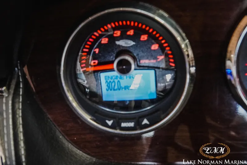 Slide: The Image of Close-up of 2018 Chaparral 227 SSX tachometer showing 302 engine hours. - 16