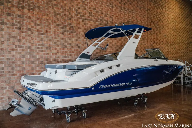 Slide: The Image of 2018 Chaparral 227 SSX boat with blue and white design at Lake Norman Marina. - 3