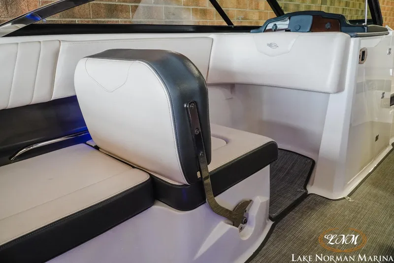 Slide: The Image of 2018 Chaparral 227 SSX boat interior with white and black seating at Lake Norman Marina. - 9