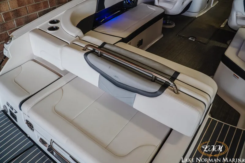 Slide: The Image of 2018 Chaparral 267 SSX boat interior with white seating and stainless steel accents. - 10