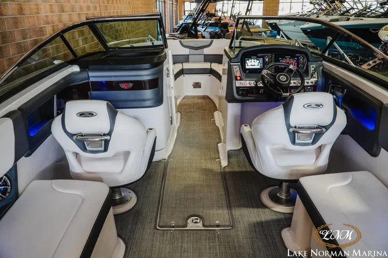 Slide: The Image of 2018 Chaparral 267 SSX boat interior with modern dashboard and seating at Lake Norman Marina. - 11
