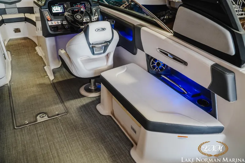 Slide: The Image of 2018 Chaparral 267 SSX boat interior with modern dashboard and seating at Lake Norman Marina. - 12