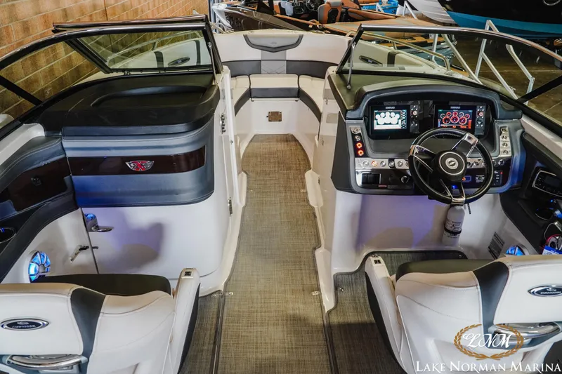 Slide: The Image of Interior view of 2018 Chaparral 267 SSX boat with modern dashboard and seating. - 13