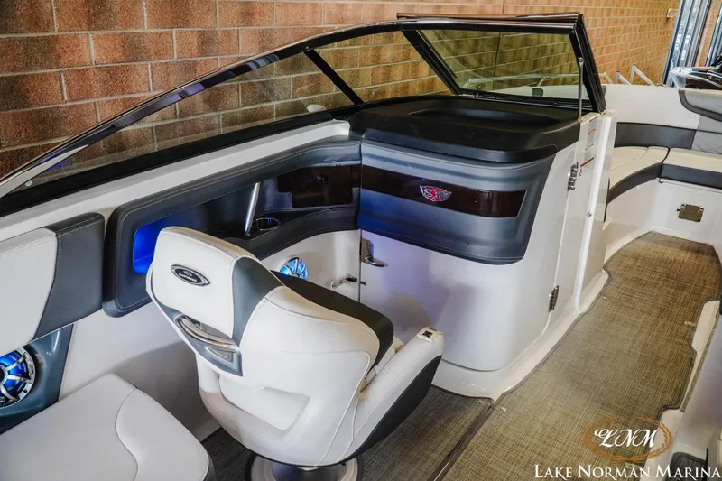 Slide: The Image of 2018 Chaparral 267 SSX boat interior with sleek seating and modern dashboard at Lake Norman Marina. - 14