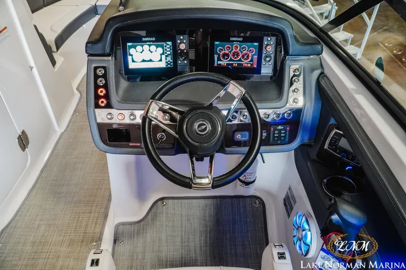 Slide: The Image of Cockpit of 2018 Chaparral 267 SSX boat with modern controls and Simrad displays. - 16