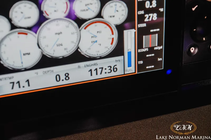 Slide: The Image of Dashboard display of a 2018 Chaparral 267 SSX boat with various gauges and readings. - 24