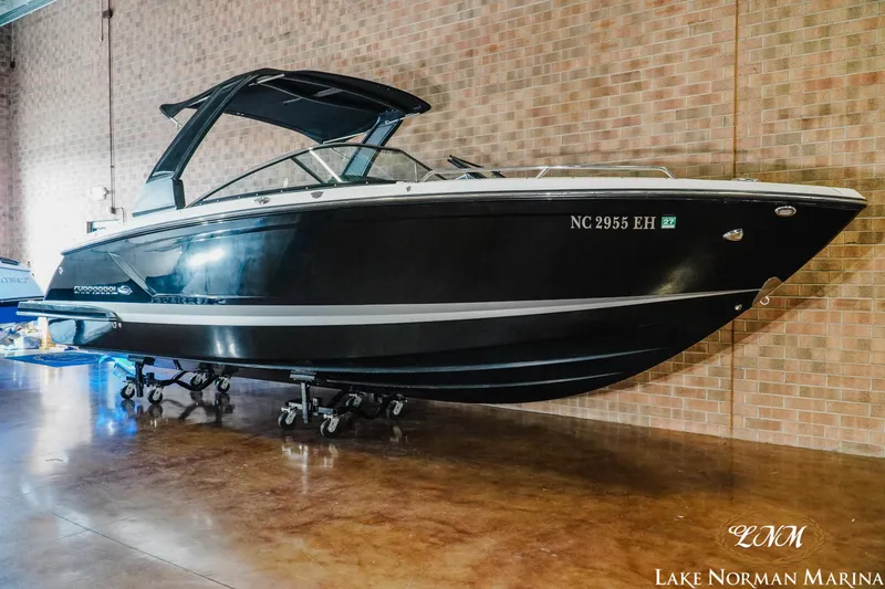 Slide: The Image of 2018 Chaparral 267 SSX boat displayed indoors at Lake Norman Marina. - 3
