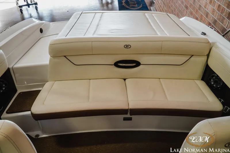 Slide: The Image of 2015 Cobalt 210 boat interior with beige leather seating at Lake Norman Marina. - 15