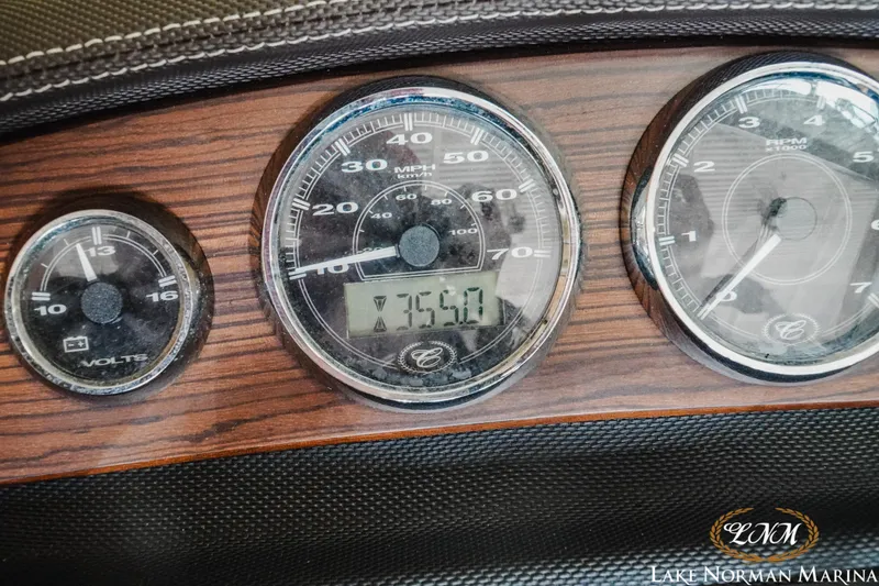 Slide: The Image of Dashboard of a 2015 Cobalt 210 boat with speedometer and voltmeter gauges. - 17