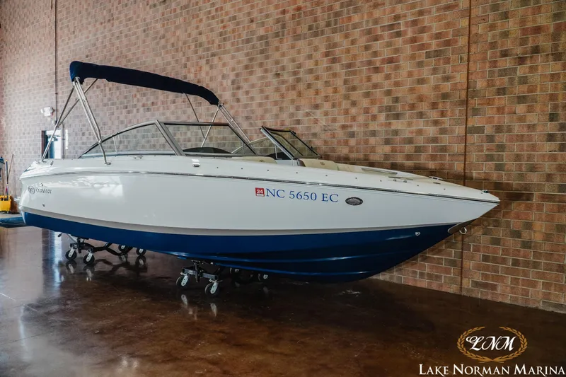 Slide: The Image of 2015 Cobalt 210 boat displayed indoors at Lake Norman Marina. - 3