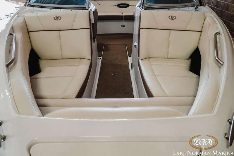 Slide: The Image of 2015 Cobalt 210 boat interior with beige seating at Lake Norman Marina. - 5