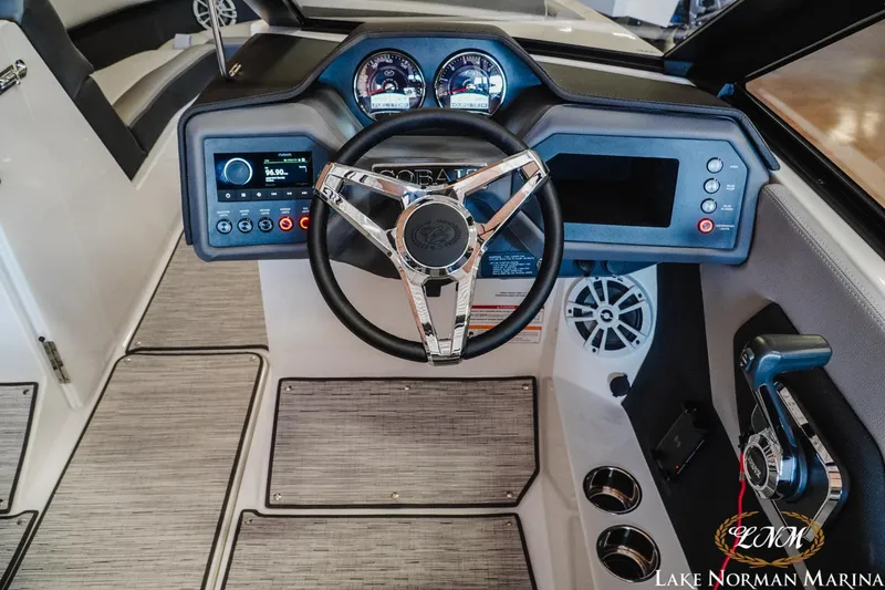 Slide: The Image of 2024 Cobalt CS22 boat dashboard with steering wheel and control panel. - 10