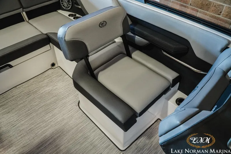 Slide: The Image of 2024 Cobalt CS22 boat interior with gray seating and Lake Norman Marina logo. - 15