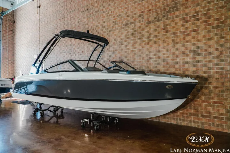 Slide: The Image of 2024 Cobalt CS22 boat displayed indoors at Lake Norman Marina. - 3