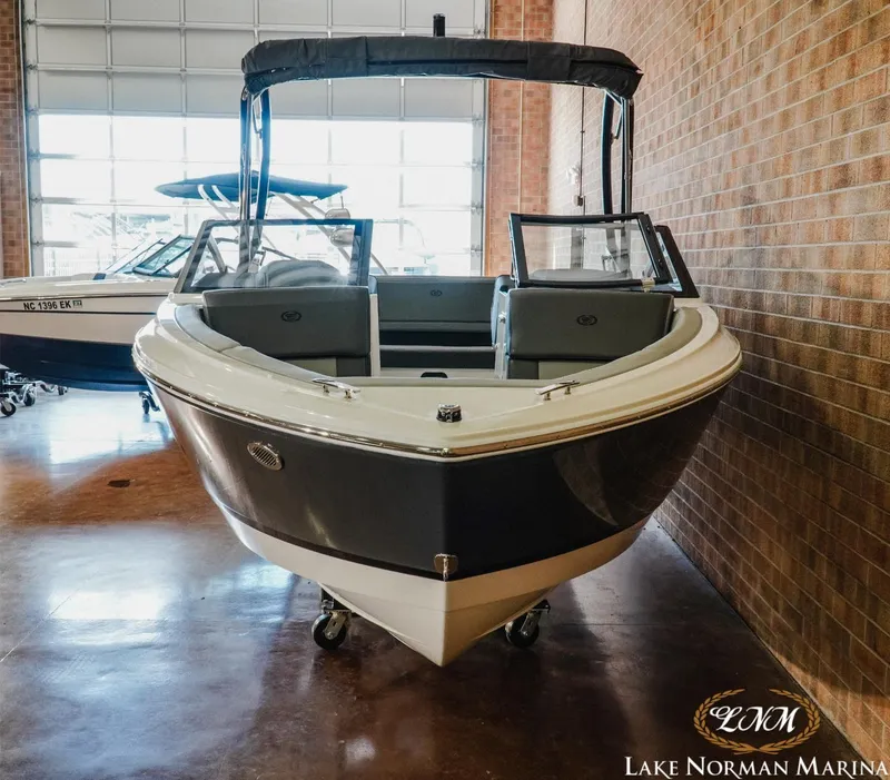 Slide: The Image of 2024 Cobalt CS22 boat displayed indoors at Lake Norman Marina. - 4