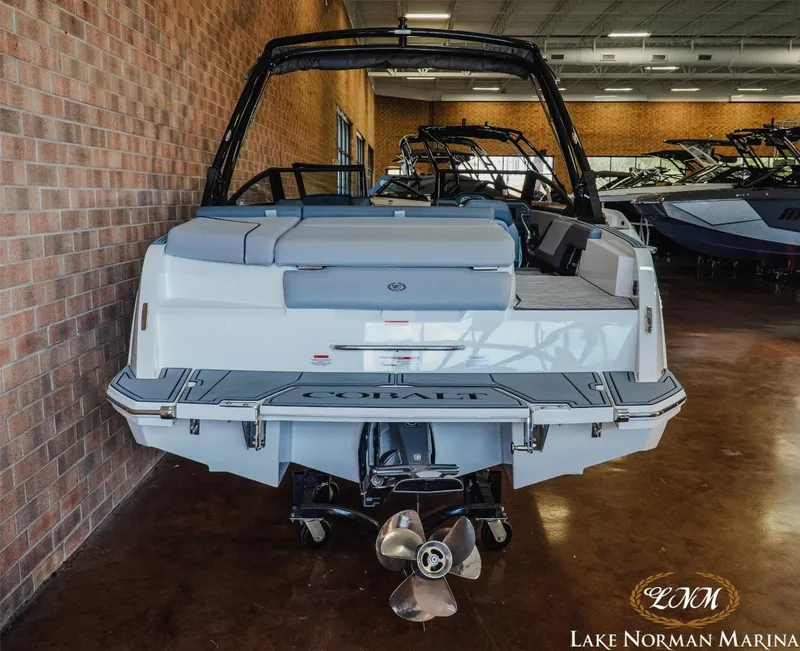 Slide: The Image of 2024 Cobalt CS22 boat displayed indoors at Lake Norman Marina. - 5