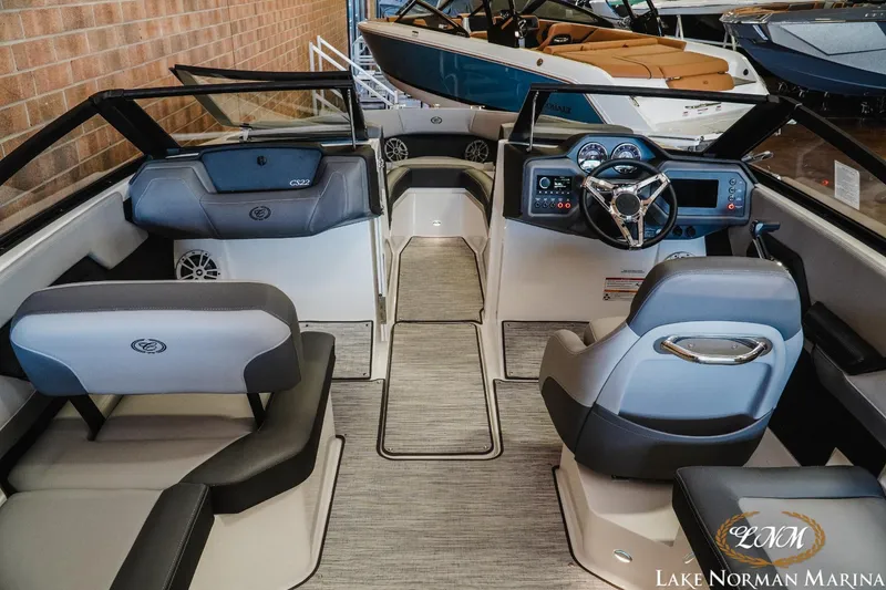 Slide: The Image of 2024 Cobalt CS22 boat interior with modern dashboard and seating at Lake Norman Marina. - 8