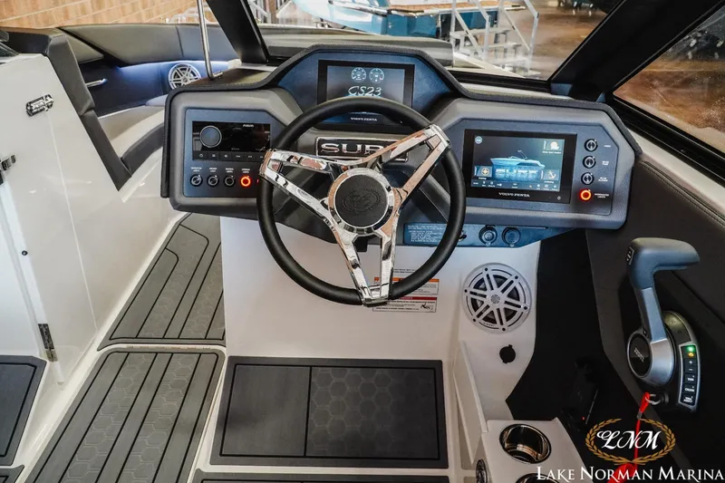 Slide: The Image of 2024 Cobalt CS23 Surf boat dashboard with advanced controls and sleek design. - 10