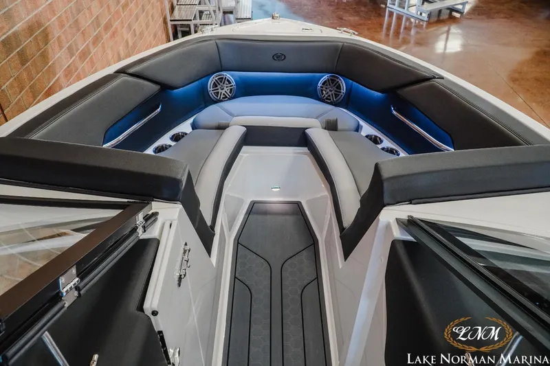 Slide: The Image of 2024 Cobalt CS23 Surf boat interior with sleek seating and modern design. - 11