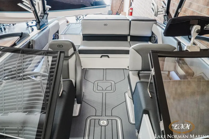 Slide: The Image of 2024 Cobalt CS23 Surf boat interior with sleek seating and modern design. - 13