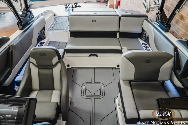 Slide: The Image of 2024 Cobalt CS23 Surf boat interior with gray seating and modern design. - 14