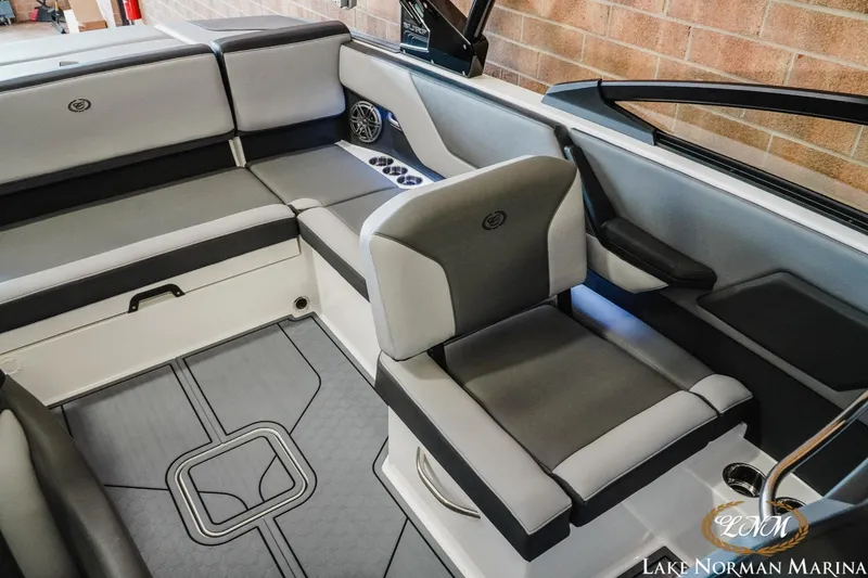 Slide: The Image of 2024 Cobalt CS23 Surf boat interior with gray seating and modern design. - 15