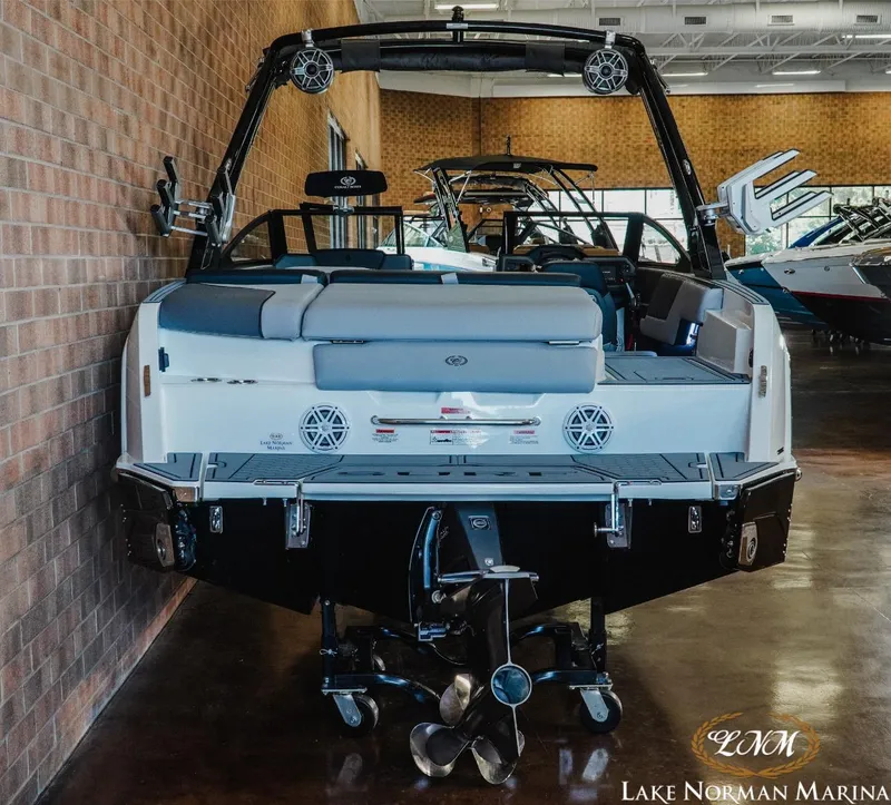 Slide: The Image of 2024 Cobalt CS23 Surf boat displayed at Lake Norman Marina showroom. - 5