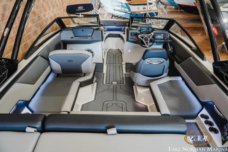 Slide: The Image of 2024 Cobalt CS23 Surf boat interior with modern seating and sleek dashboard design. - 7