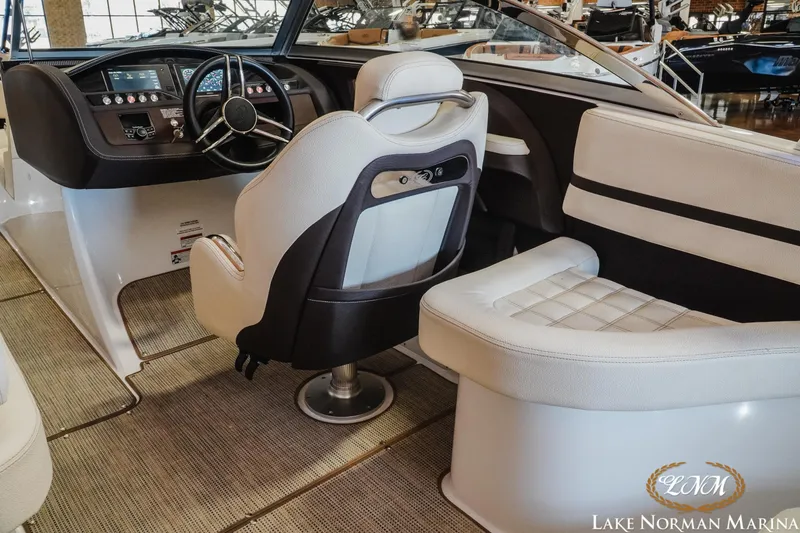 Slide: The Image of 2020 Cobalt R3 boat interior with steering wheel and seating at Lake Norman Marina. - 12