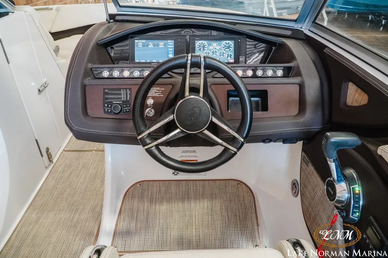 Slide: The Image of 2020 Cobalt R3 boat dashboard with steering wheel and control panel at Lake Norman Marina. - 13