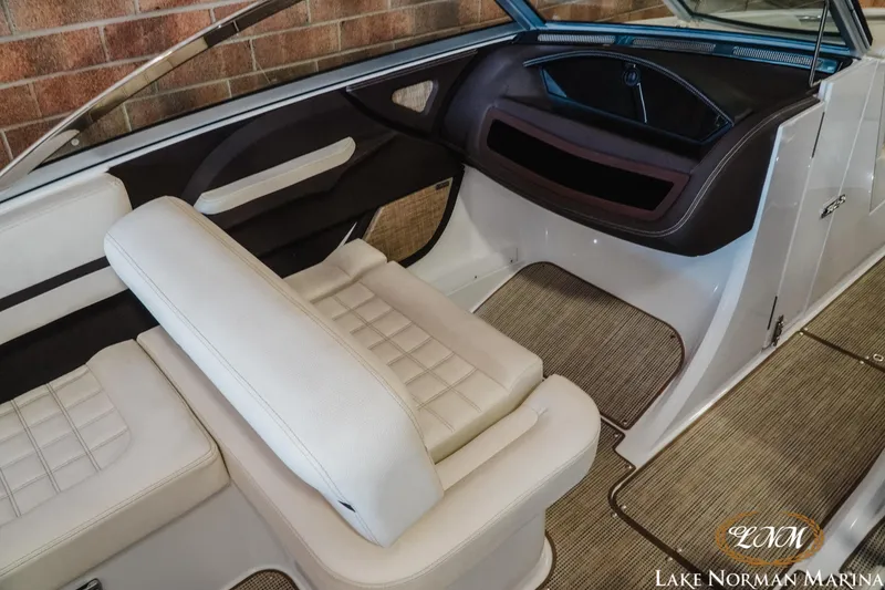 Slide: The Image of 2020 Cobalt R3 boat interior with white seating and carpeted flooring at Lake Norman Marina. - 14