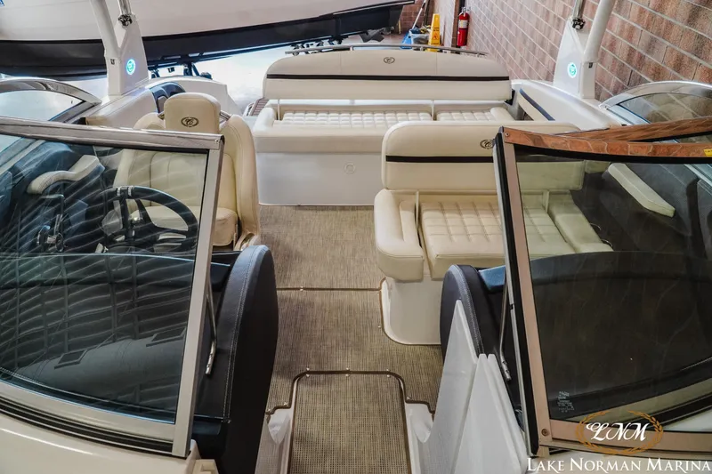Slide: The Image of 2020 Cobalt R3 boat interior with beige seating at Lake Norman Marina. - 17