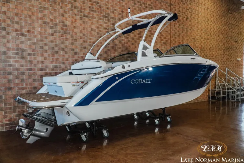 Slide: The Image of 2020 Cobalt R3 boat displayed indoors at Lake Norman Marina. - 2