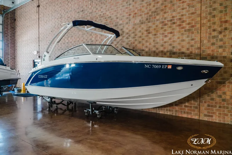 Slide: The Image of 2020 Cobalt R3 boat in showroom at Lake Norman Marina, blue and white exterior. - 3