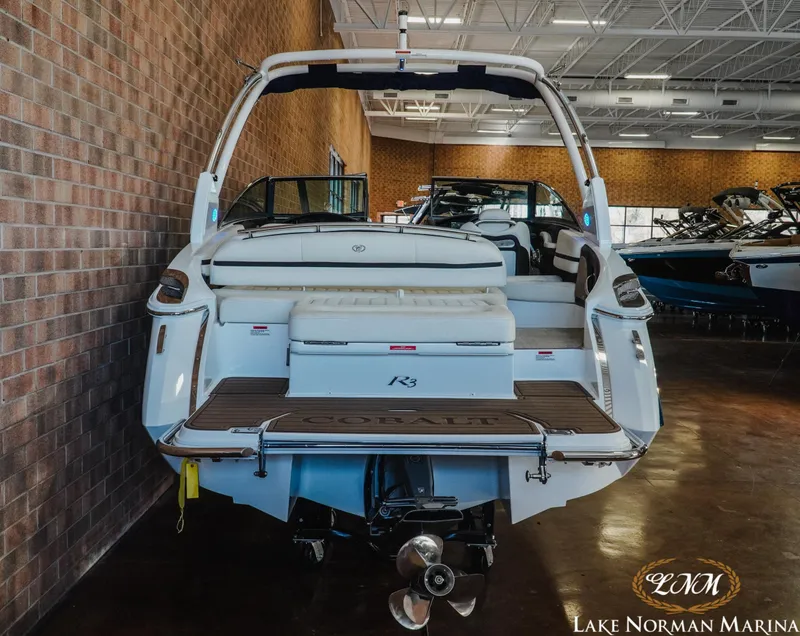 Slide: The Image of 2020 Cobalt R3 boat displayed indoors at Lake Norman Marina. - 6