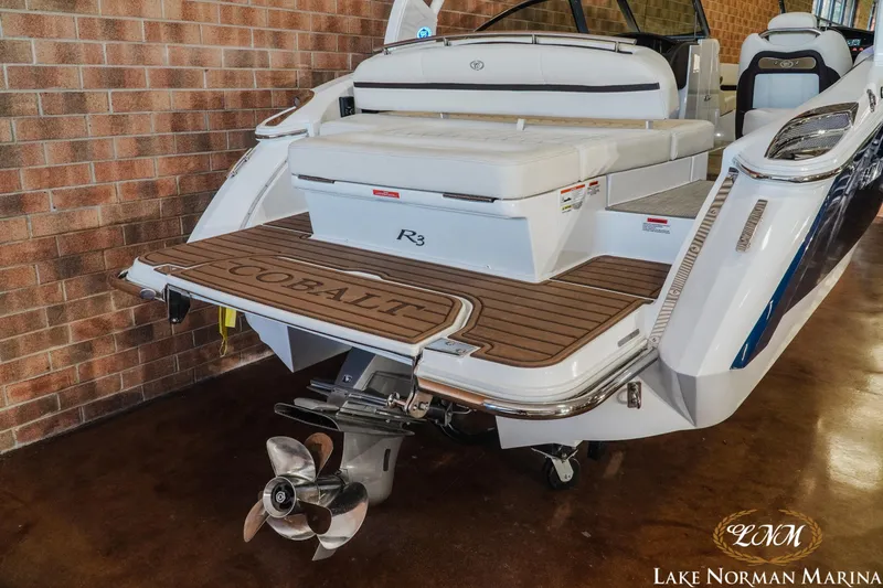 Slide: The Image of 2020 Cobalt R3 boat at Lake Norman Marina, featuring sleek design and powerful engine. - 8