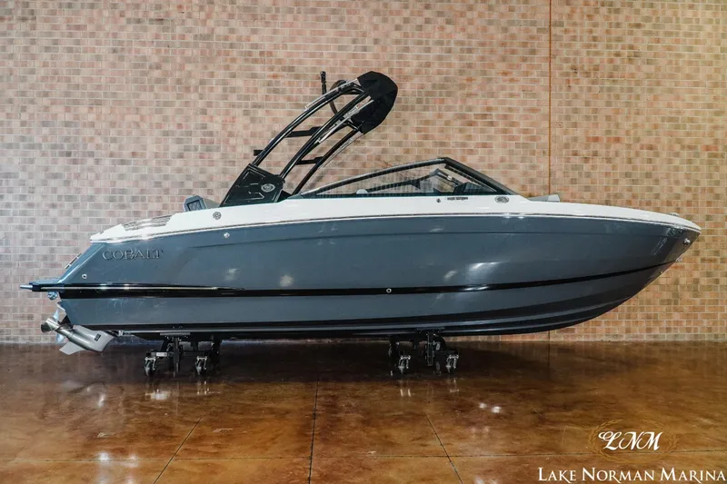 Slide: The Image of 2025 Cobalt R4 boat displayed indoors at Lake Norman Marina. - 1