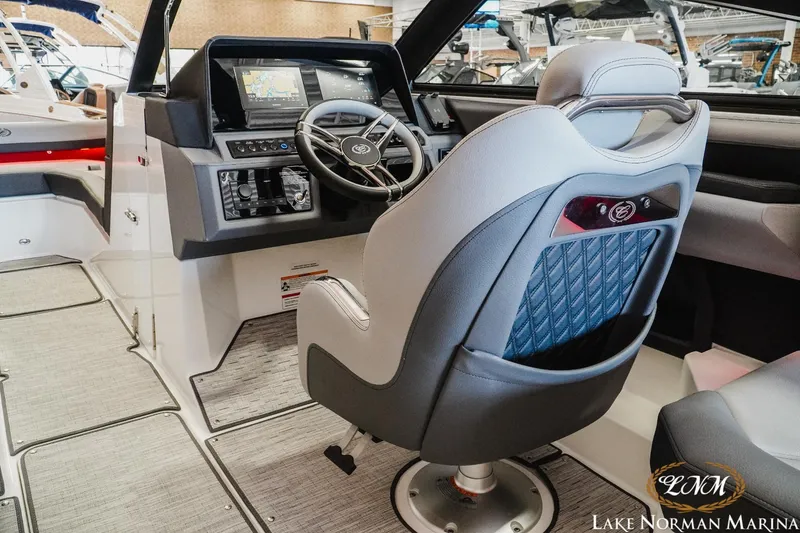 Slide: The Image of Interior of 2025 Cobalt R4 boat with modern dashboard and steering wheel at Lake Norman Marina. - 10