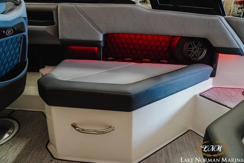 Slide: The Image of Luxurious interior of 2025 Cobalt R4 boat with ambient red lighting and premium seating. - 12