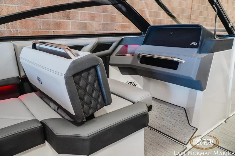 Slide: The Image of 2025 Cobalt R4 boat interior with modern seating and dashboard design. - 13