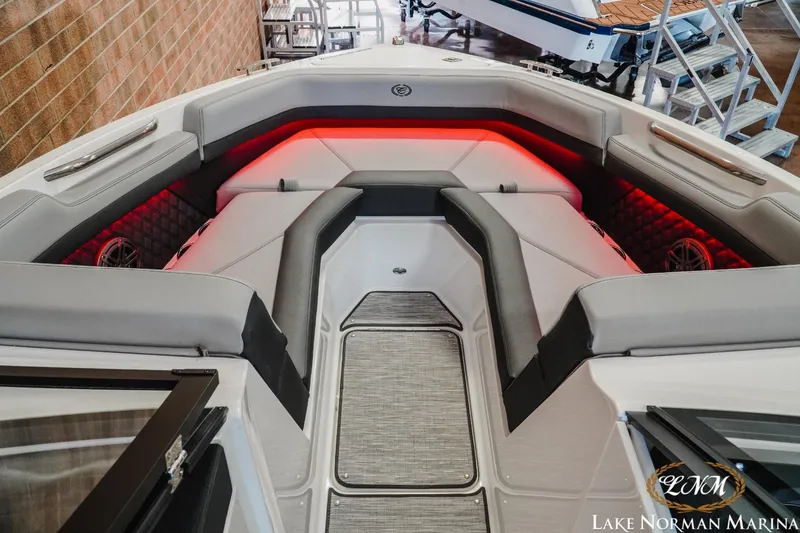 Slide: The Image of 2025 Cobalt R4 boat interior with red LED lighting and luxurious seating at Lake Norman Marina. - 14