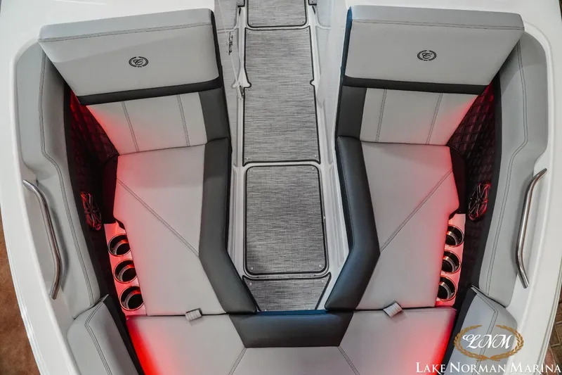 Slide: The Image of Luxurious interior of 2025 Cobalt R4 boat with red ambient lighting and comfortable seating. - 15