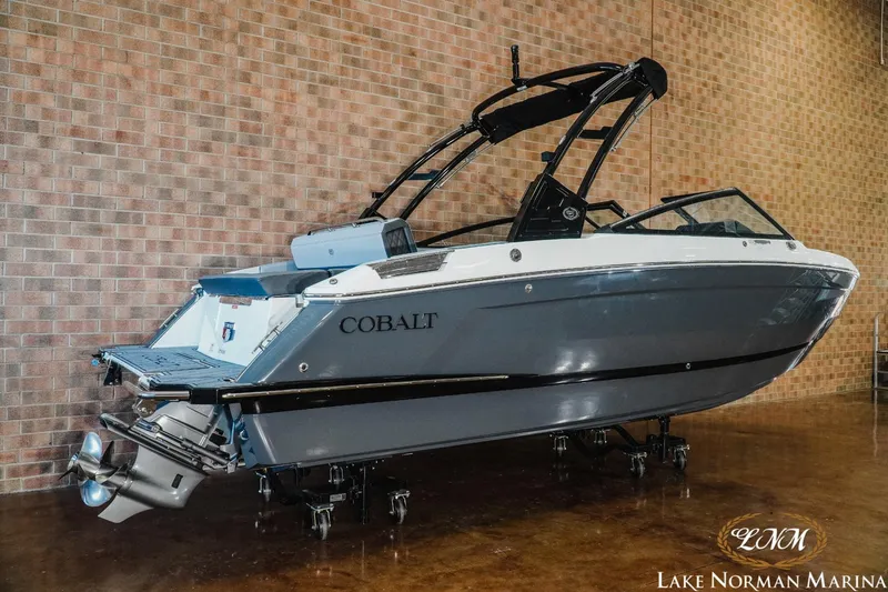 Slide: The Image of 2025 Cobalt R4 boat displayed indoors at Lake Norman Marina. - 2