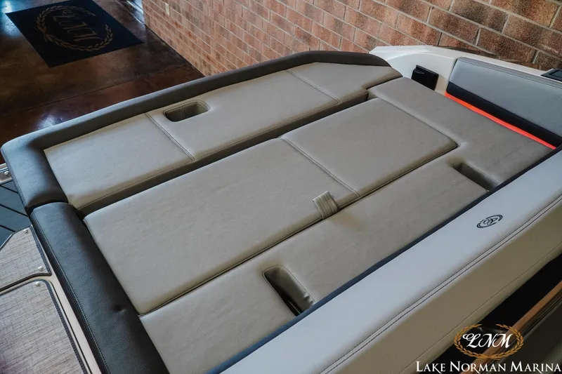 Slide: The Image of 2025 Cobalt R4 boat interior with cushioned seating at Lake Norman Marina. - 21