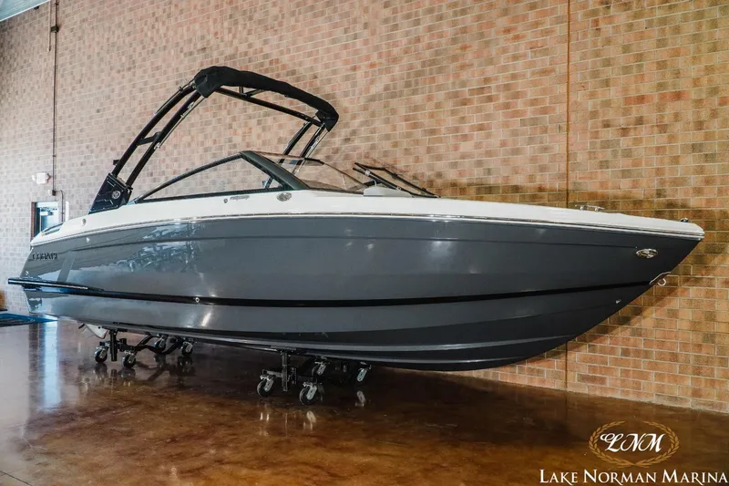Slide: The Image of 2025 Cobalt R4 boat displayed indoors at Lake Norman Marina. - 3