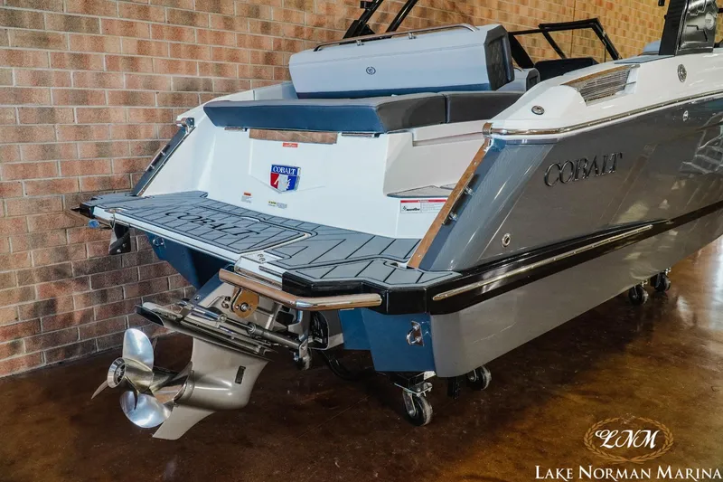 Slide: The Image of 2025 Cobalt R4 boat at Lake Norman Marina, showcasing sleek design and powerful engine. - 5