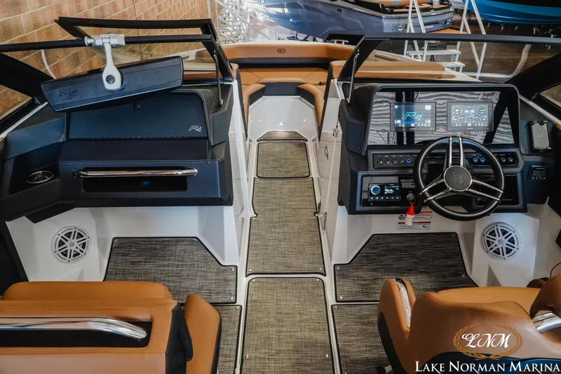 Slide: The Image of 2024 Cobalt R4 boat interior with modern dashboard and luxurious seating at Lake Norman Marina. - 10